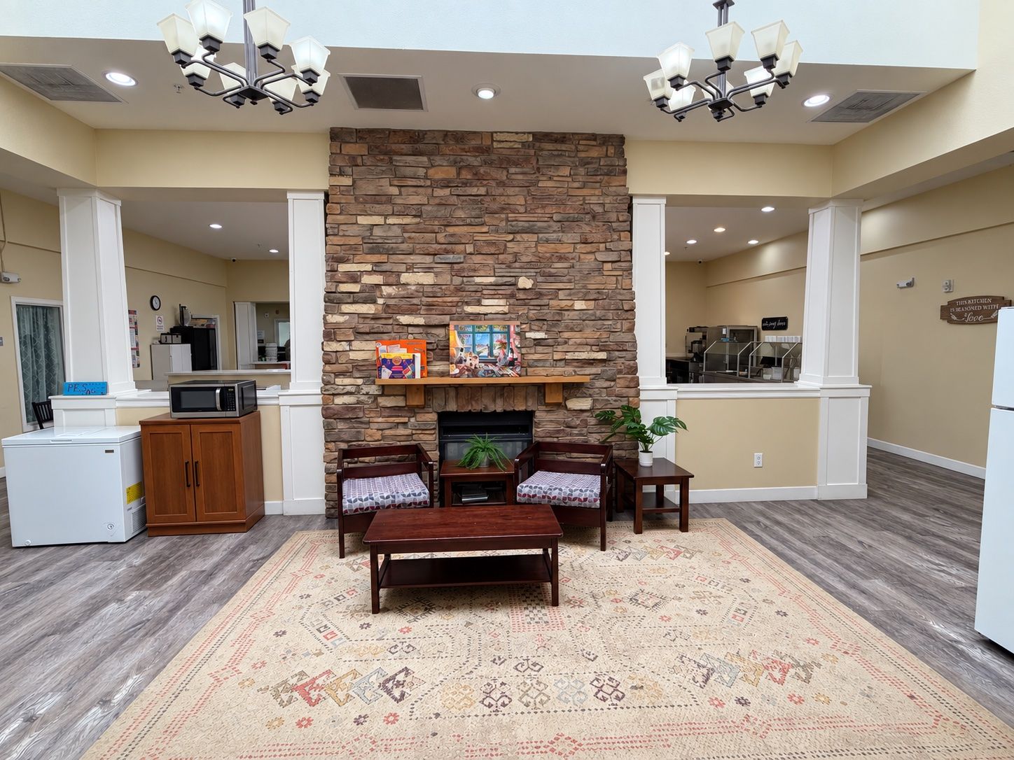 Dining room with a stone fireplace and seating