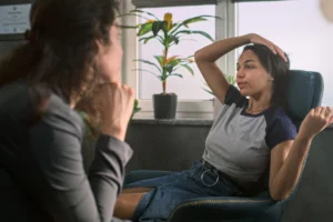 Woman sitting next to therapist